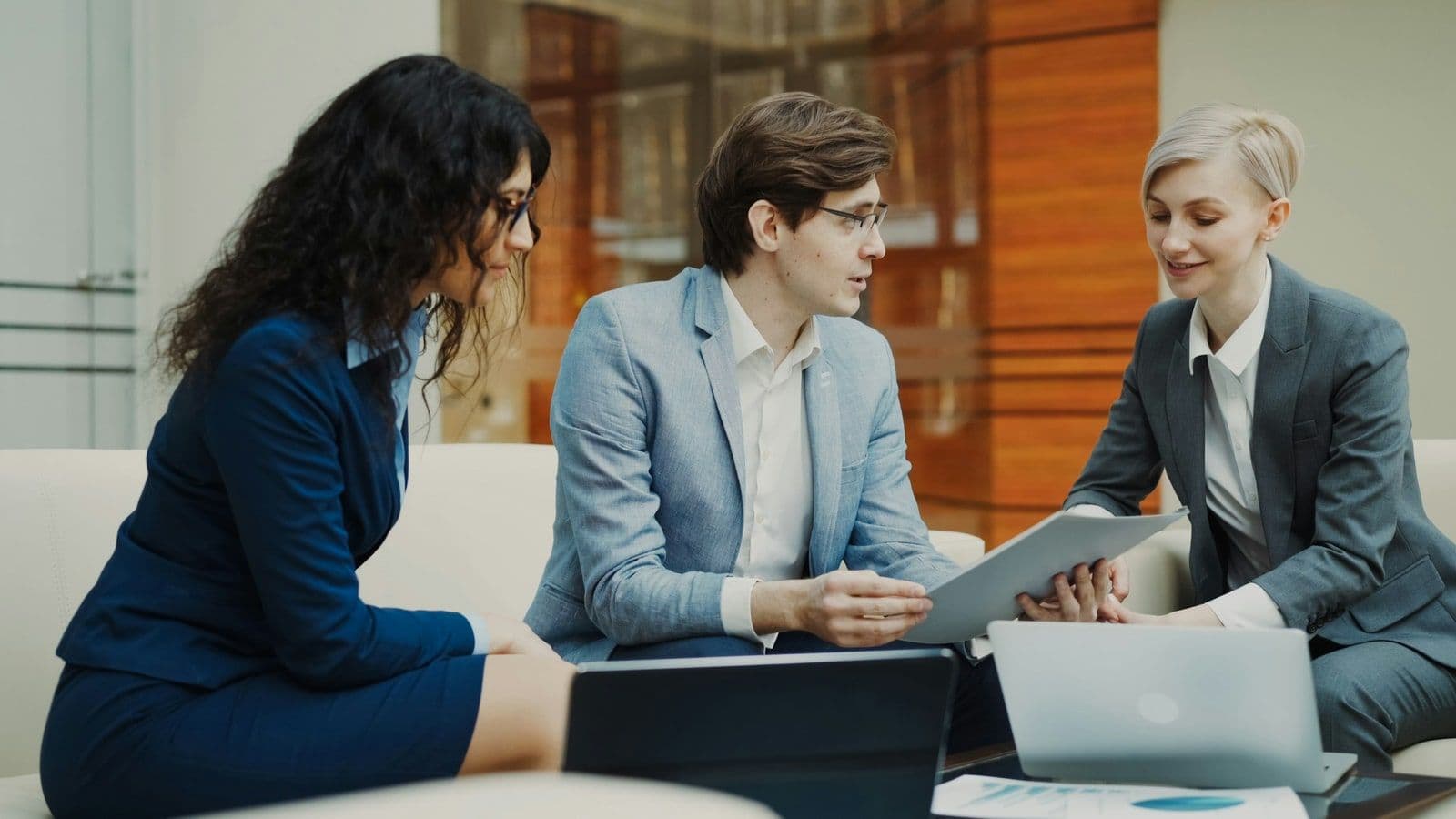Field sales team reviewing customer follow-up actions after a meeting